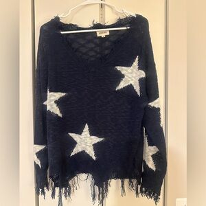 Distressed star woven sweater